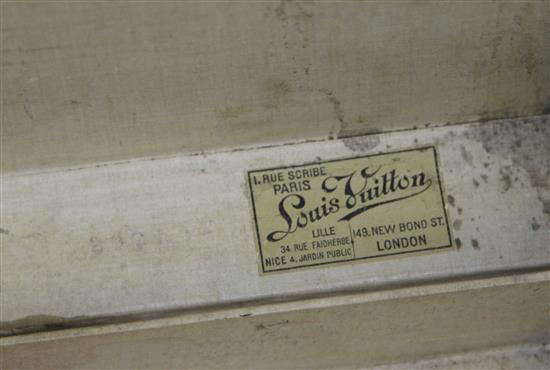 A Louis Vuitton leather suitcase, 26 x 16.5 x 8.5in.